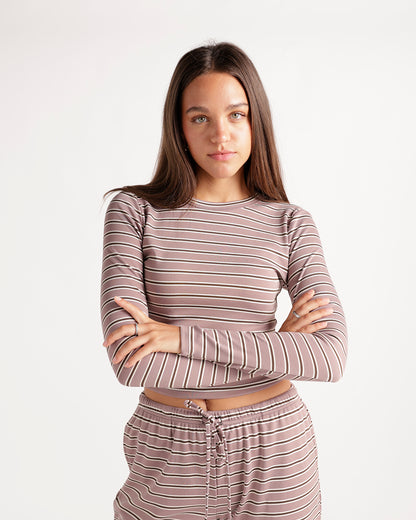 Mauve striped long sleeve crop top with ribbed texture, worn with matching bottoms