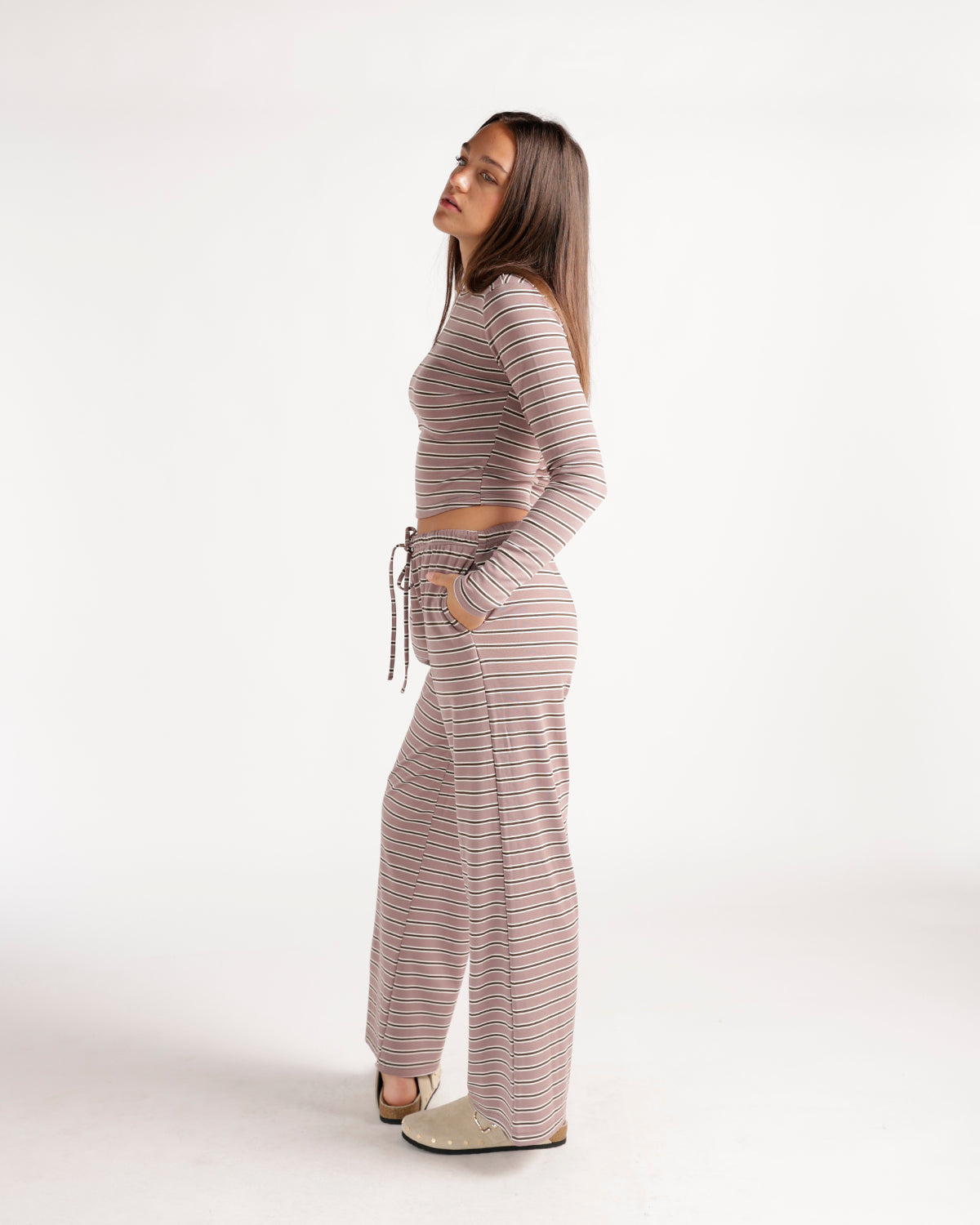 Striped wide-leg lounge pants in pink and brown with drawstring waist.