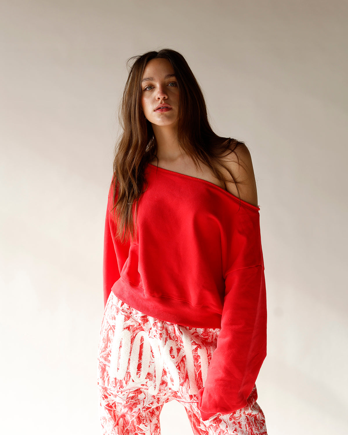 red off the shoulder top red off the shoulder sweatshirt raw hem off the shoulder red sweatshirt