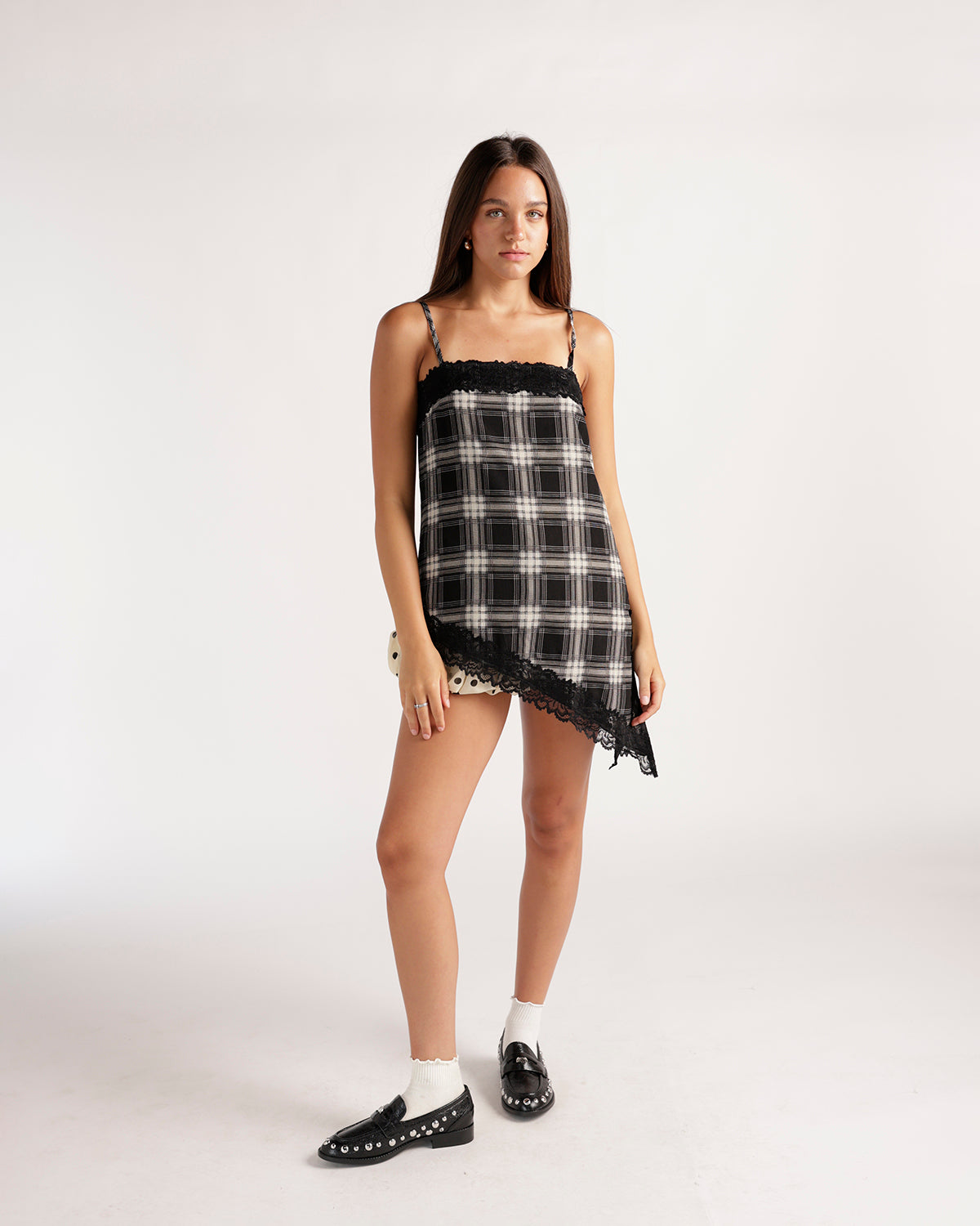 Black and white plaid cami mini dress with black lace trim and asymmetric hem
