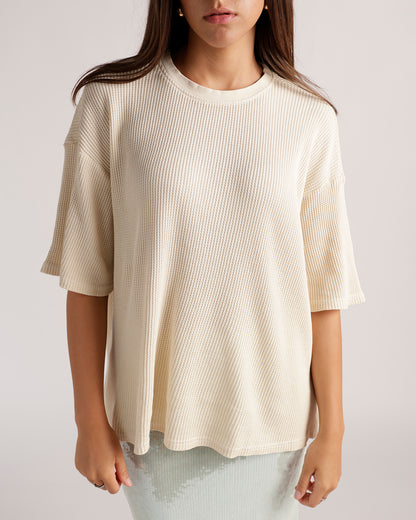 Oversized cream waffle-knit short sleeve tee with crew neck and relaxed fit