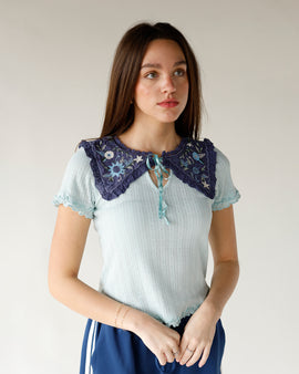 Light blue pointelle ruffle tee with a ruffle hem, sailor collar, and embroidered detail free people pastel blue knit top