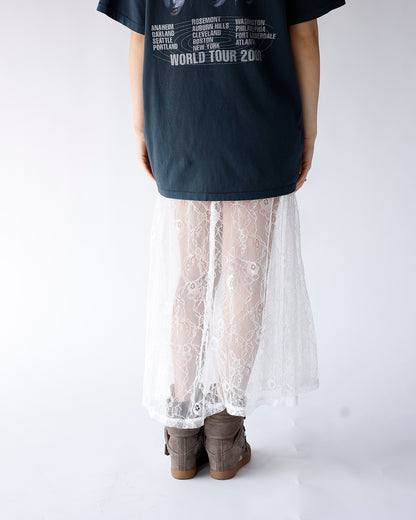White floral lace maxi skirt styled with dark band tee and gray boots