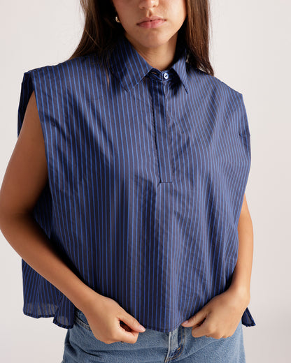 Navy blue pinstripe sleeveless collared popover top with half-button placket