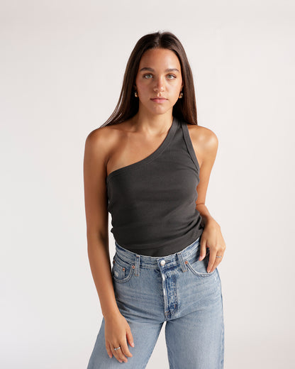 Sophisticated one shoulder top in dark grey ribbed fabric. Flattering fit, perfect for dressing up or down. 100% organic cotton. Care: Hand wash only.