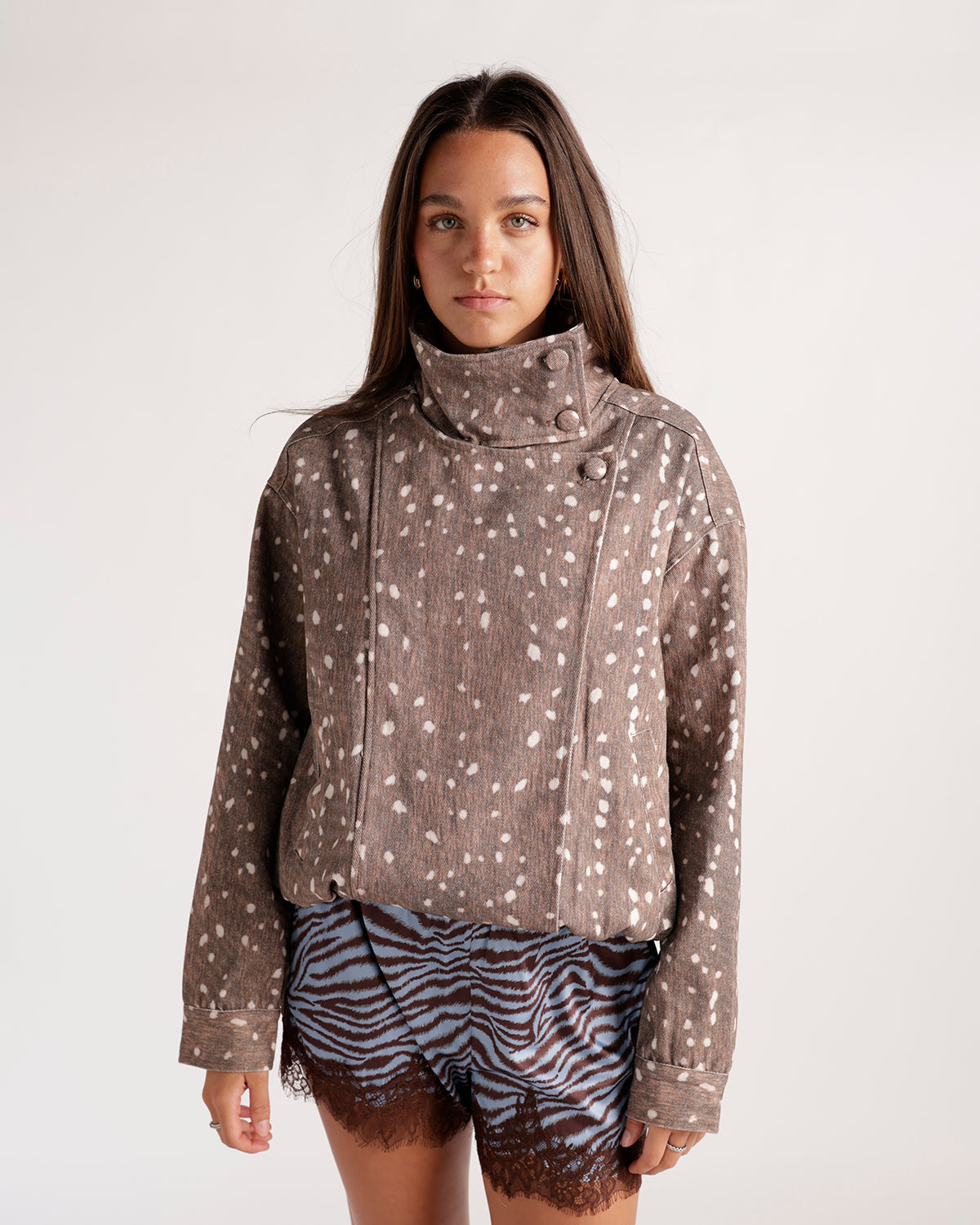 Brown spotted fawn print moto jacket with high collar and snap buttons