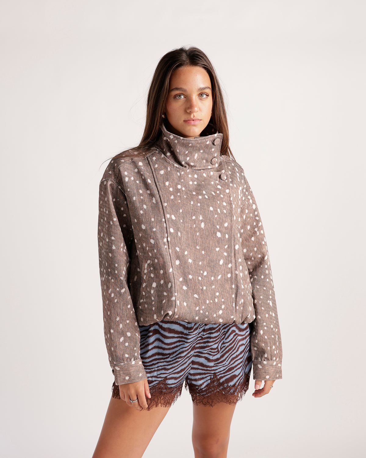 Cropped fawn-spot print jacket with high collar and asymmetric button closure