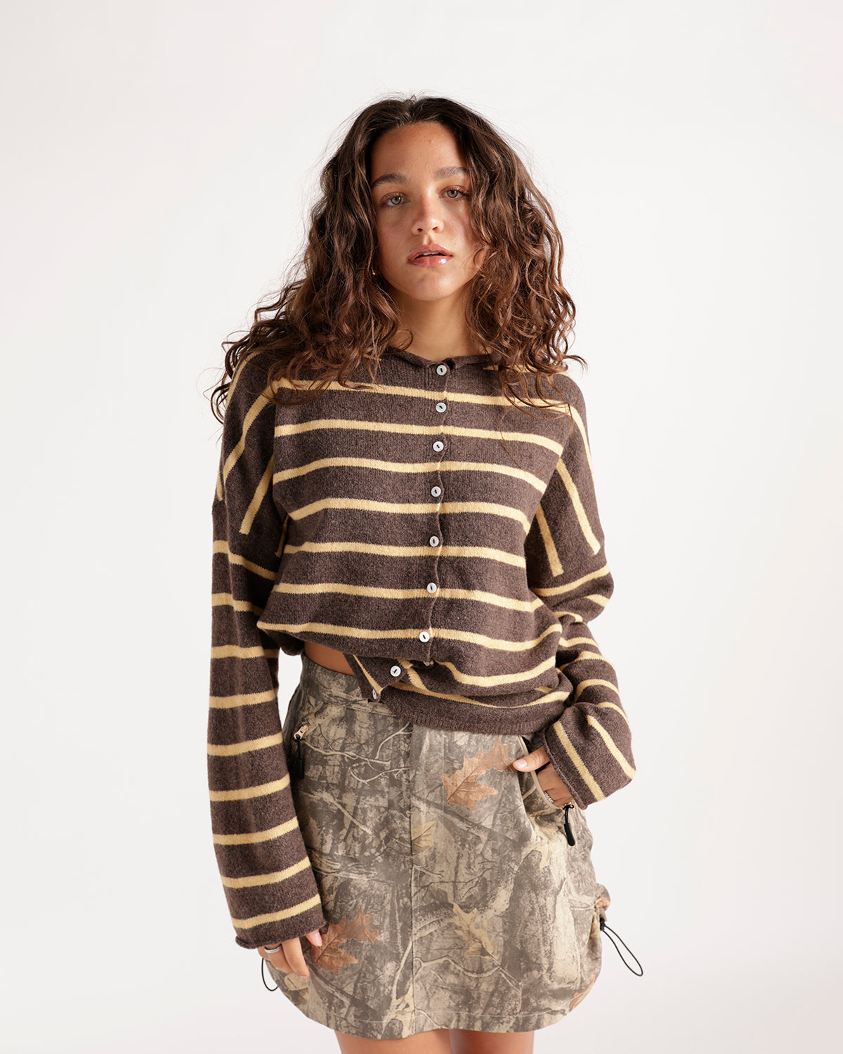 Cropped brown and yellow striped button-front cardigan with long sleeves