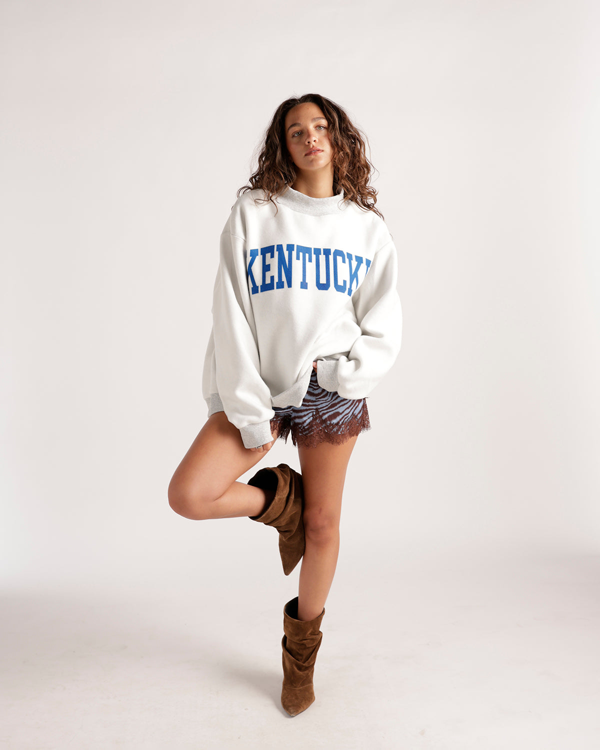 Oversized white Kentucky graphic crewneck sweatshirt with blue varsity lettering