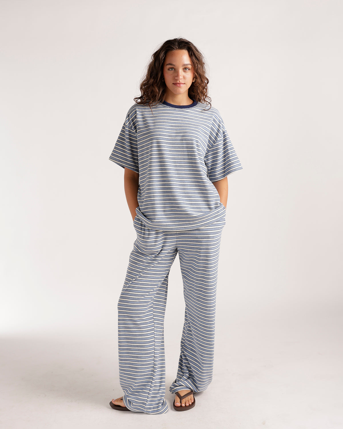 Oversized striped blue and white short-sleeve tee with navy crew neck collar