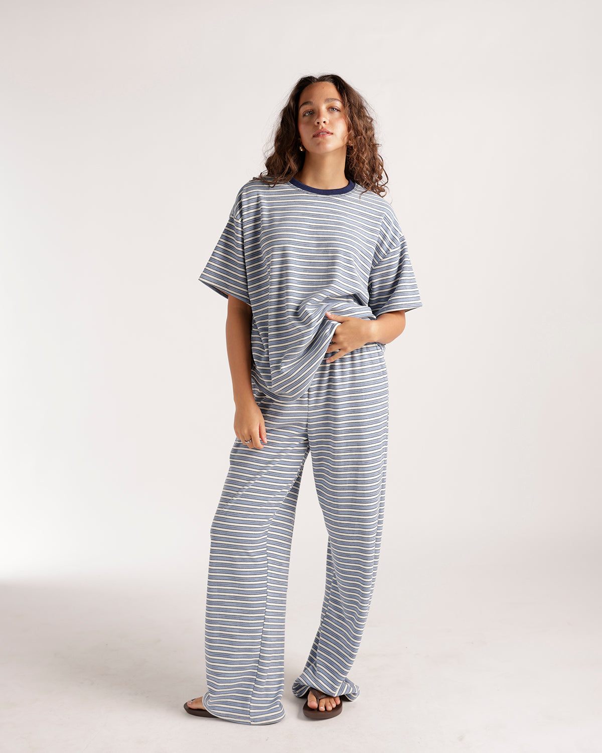Oversized striped blue and white short sleeve tee with navy crew neck collar