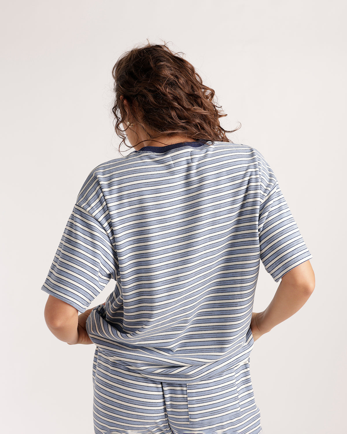 Blue and white striped short sleeve oversized tee, back view, matching shorts