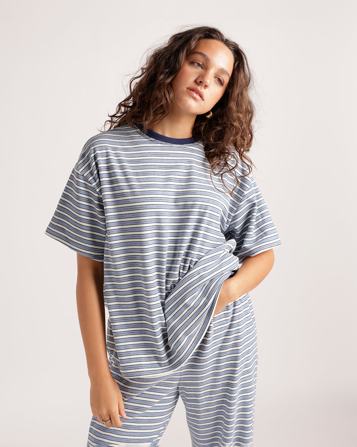Oversized blue and white striped short sleeve t-shirt with navy ribbed crew neck