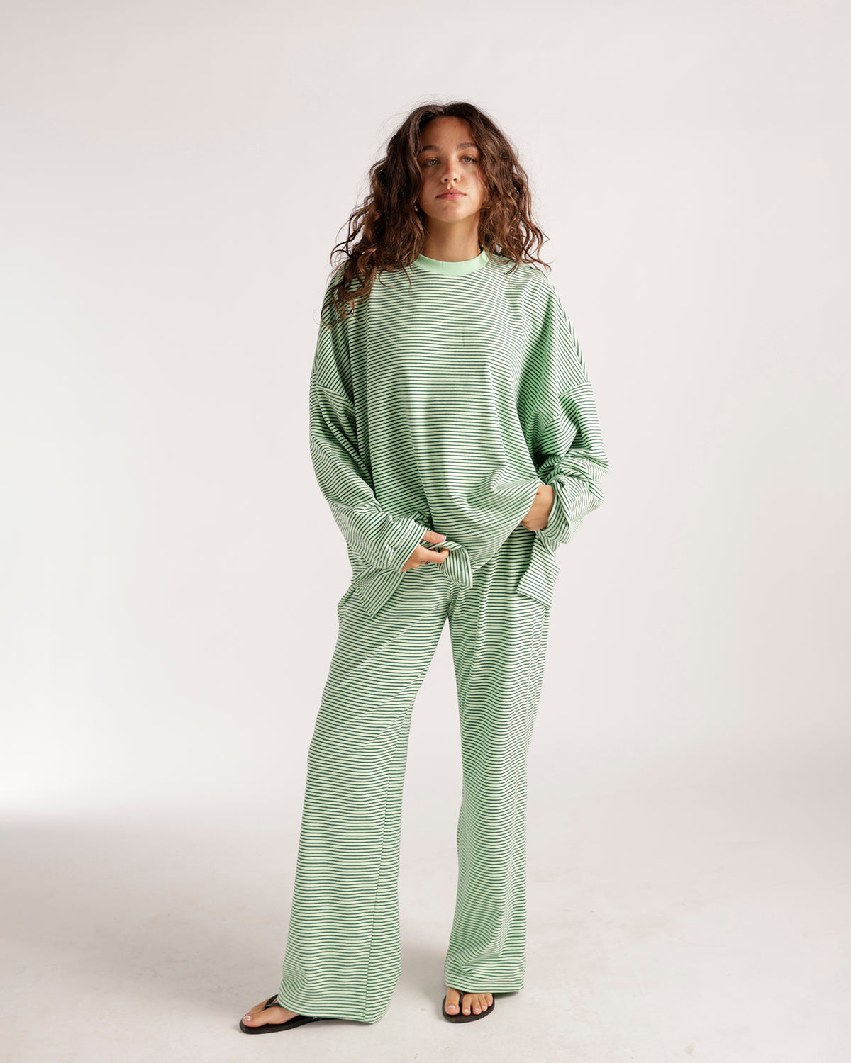 Oversized green and white striped long sleeve top with crew neck