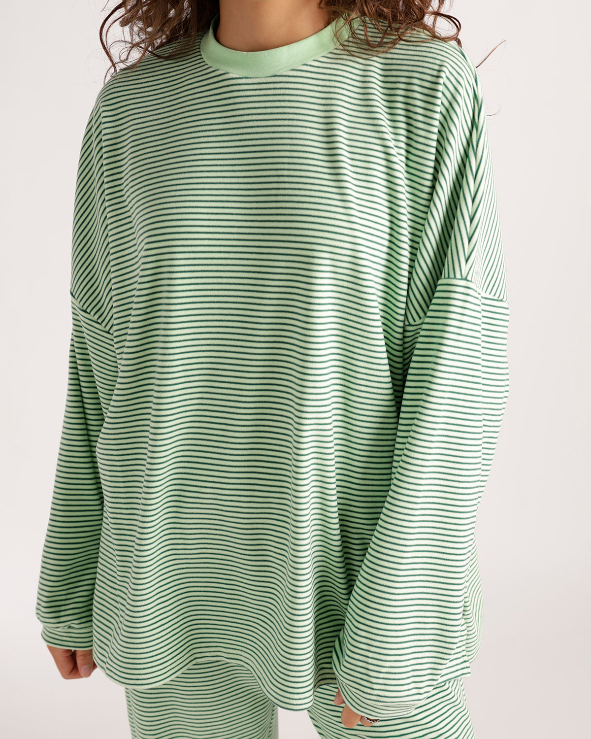 Oversized green and white striped long sleeve crew neck top