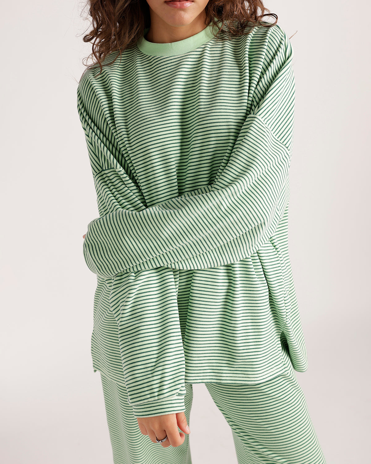 Oversized green and white striped long sleeve sweatshirt with ribbed crew neck