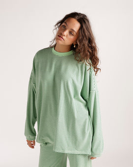 Oversized green striped long sleeve top with crew neck and relaxed fit