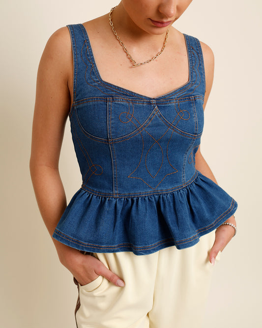 Dark denim peplum top with embroidered detailing