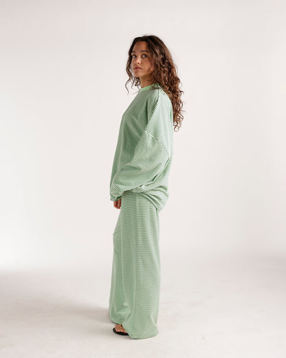 Oversized green and white striped long sleeve top with relaxed fit