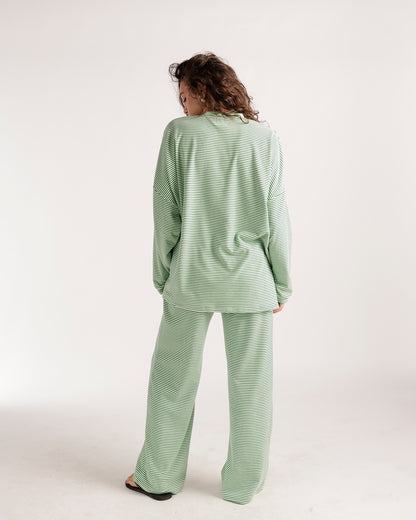 Oversized green and white striped long sleeve top, relaxed fit, back view