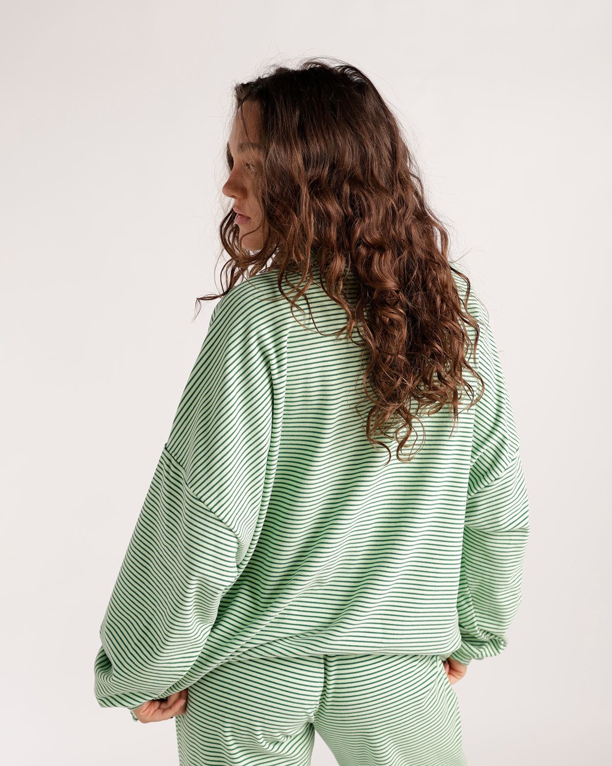 Oversized green and white striped long sleeve top, back view, relaxed fit