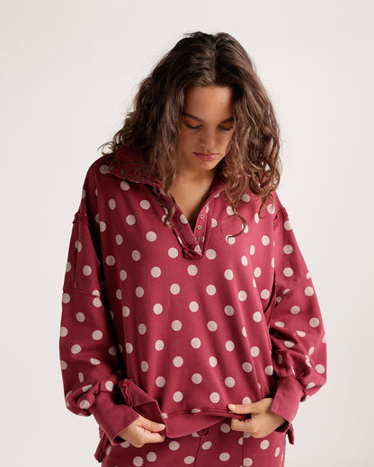 Oversized burgundy polka dot pullover sweatshirt with snap collar and ribbed cuffs