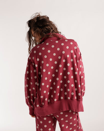 Burgundy polka dot pullover sweatshirt with matching pants, back view