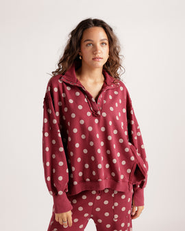 Stay cozy in this burgundy polka dot pullover featuring blush pink dots, a silver snap-button collar, and a relaxed cropped fit. Perfect for pairing with jeans or joggers, this effortlessly cute sweatshirt is ideal for casual weekends, brunch dates, and everyday layering.