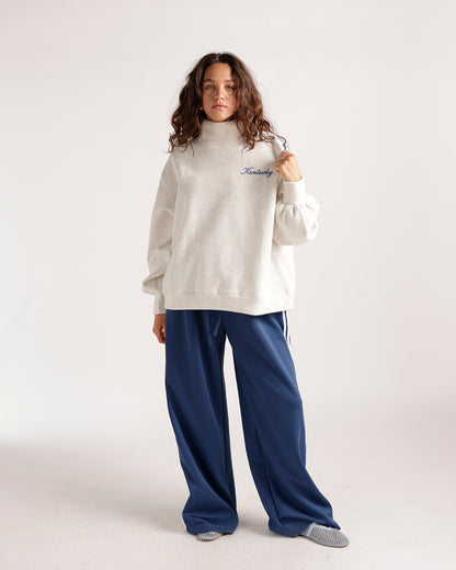 Oatmeal mock neck sweatshirt with cursive Kentucky embroidery on chest