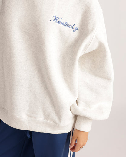 Oversized oatmeal heather sweatshirt with blue embroidered Kentucky script on chest