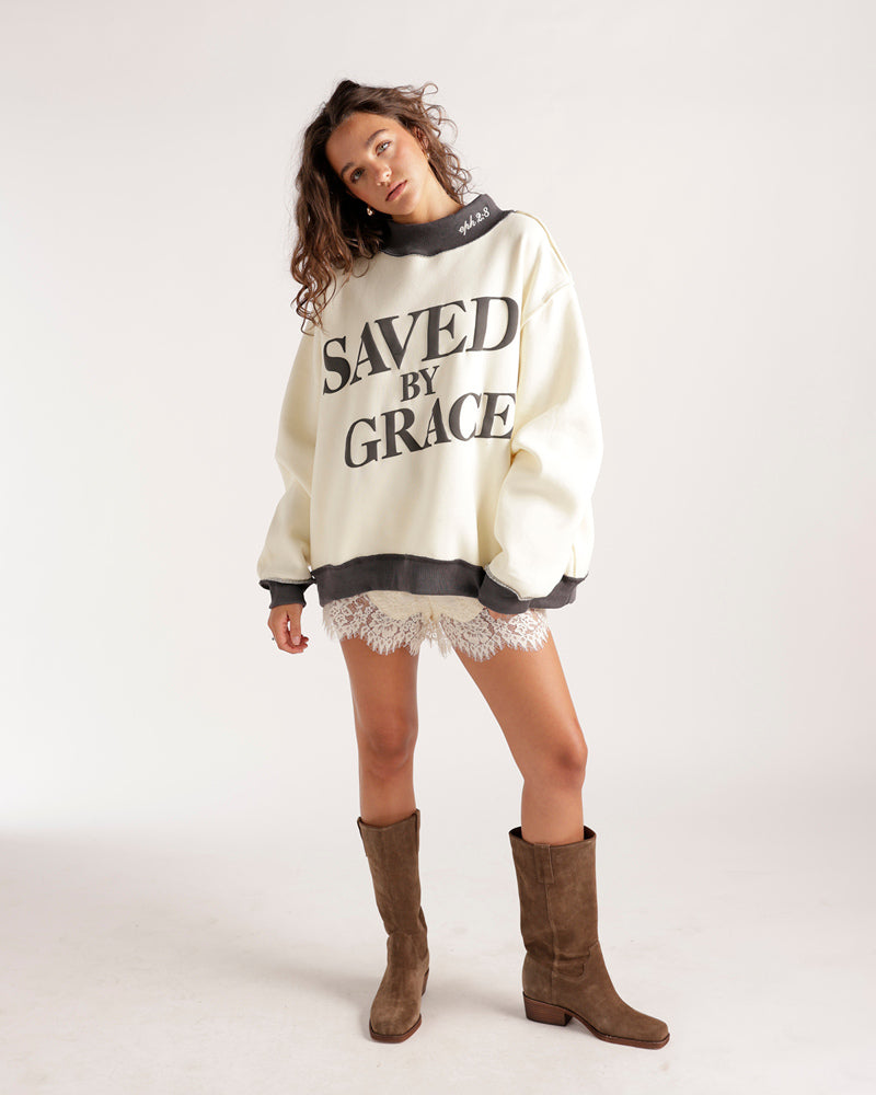 Oversized cream mockneck sweatshirt with Saved By Grace graphic print in charcoal