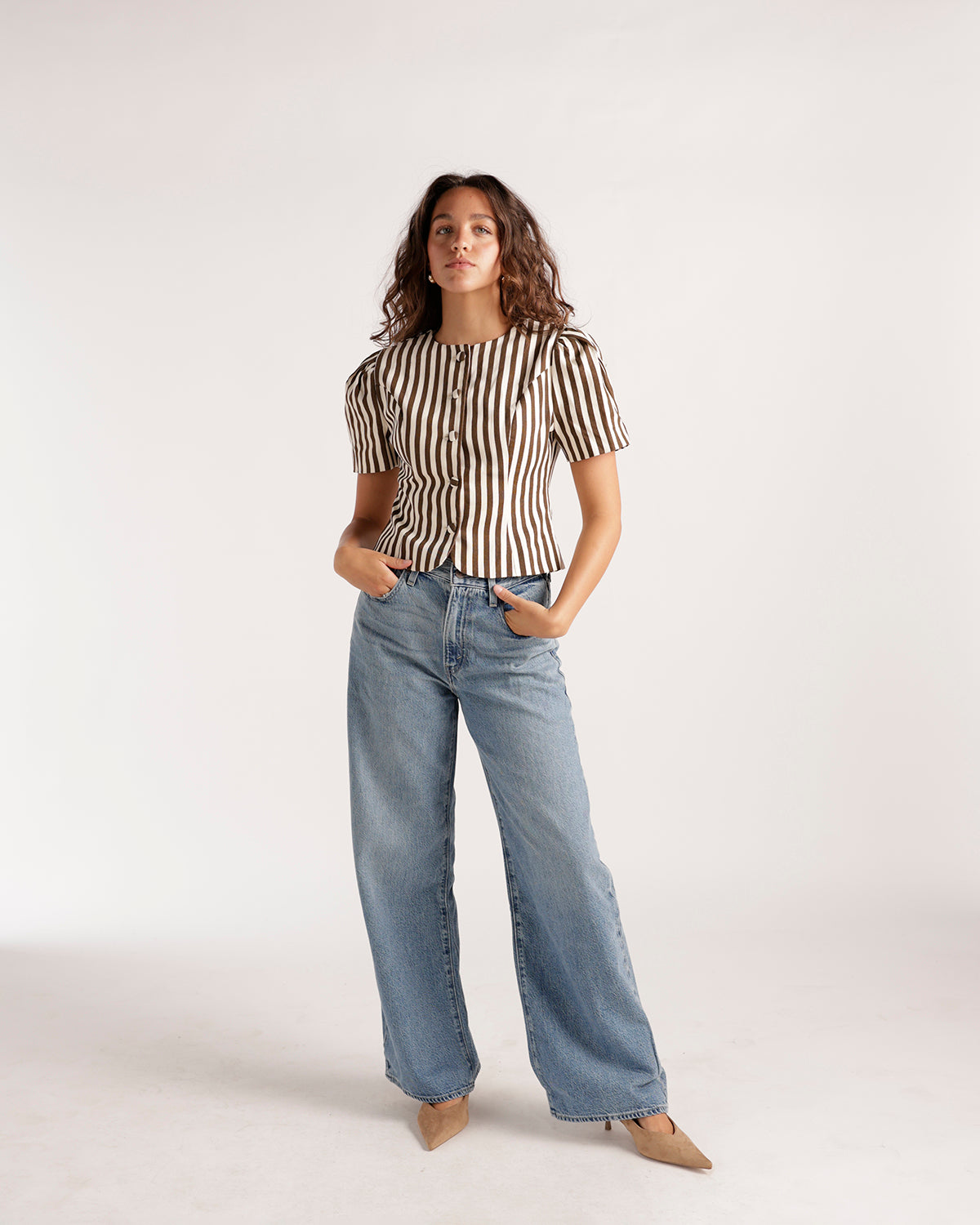 Wide leg light wash blue denim jeans with relaxed fit and straight silhouette