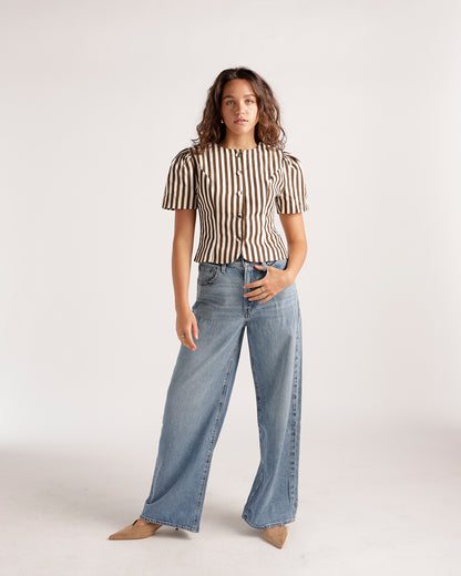 Light blue wide-leg denim jeans with a relaxed fit and subtle wash