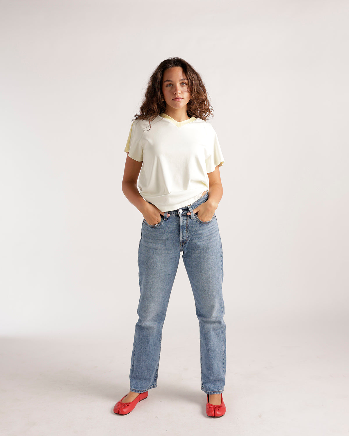 Light wash straight-leg denim jeans with classic five-pocket styling