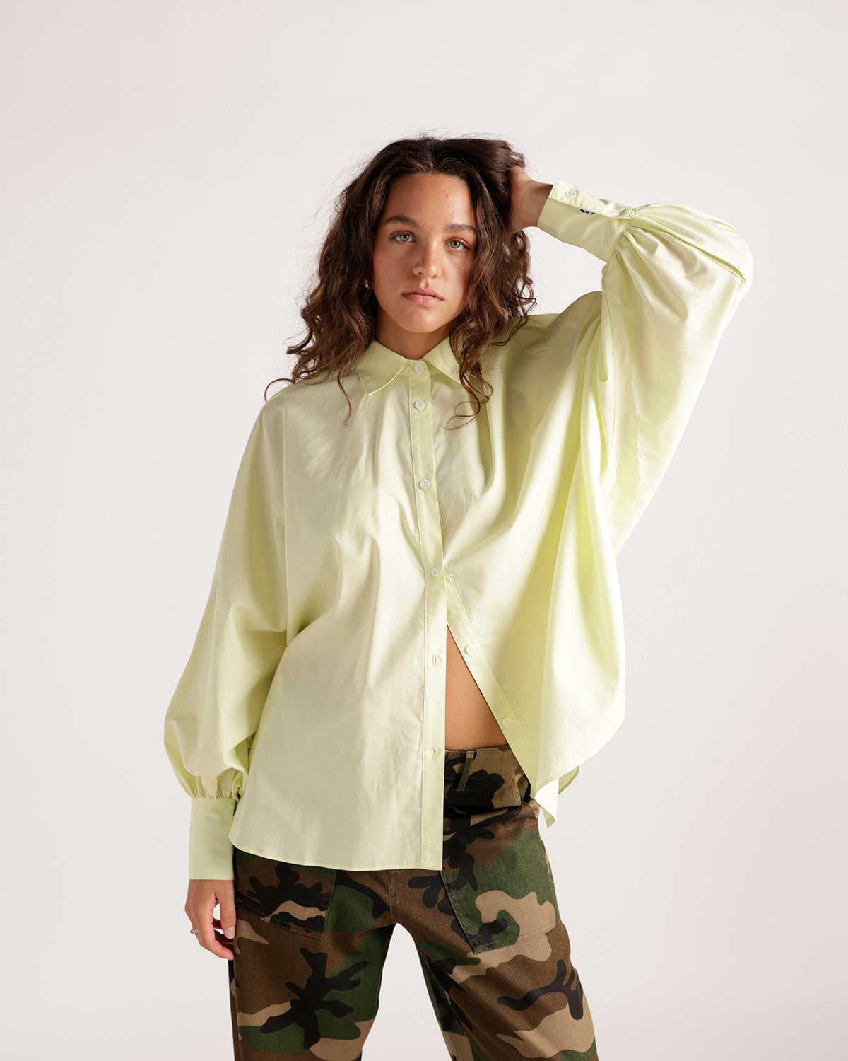 Pale yellow oversized button-up shirt with balloon sleeves and collar