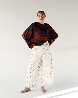 brown and white polka dot print barrel leg jeans