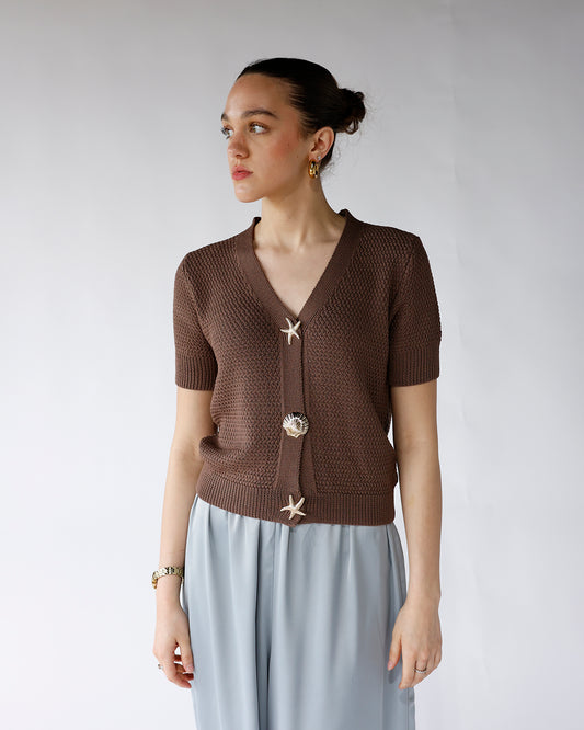 brown short sleeve knit with gold seashell buttons short sleeve button front sweater with gold seas shell themed buttons