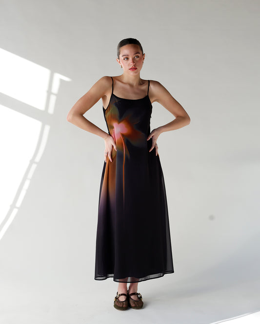 black slip dress with colored gradient floral design