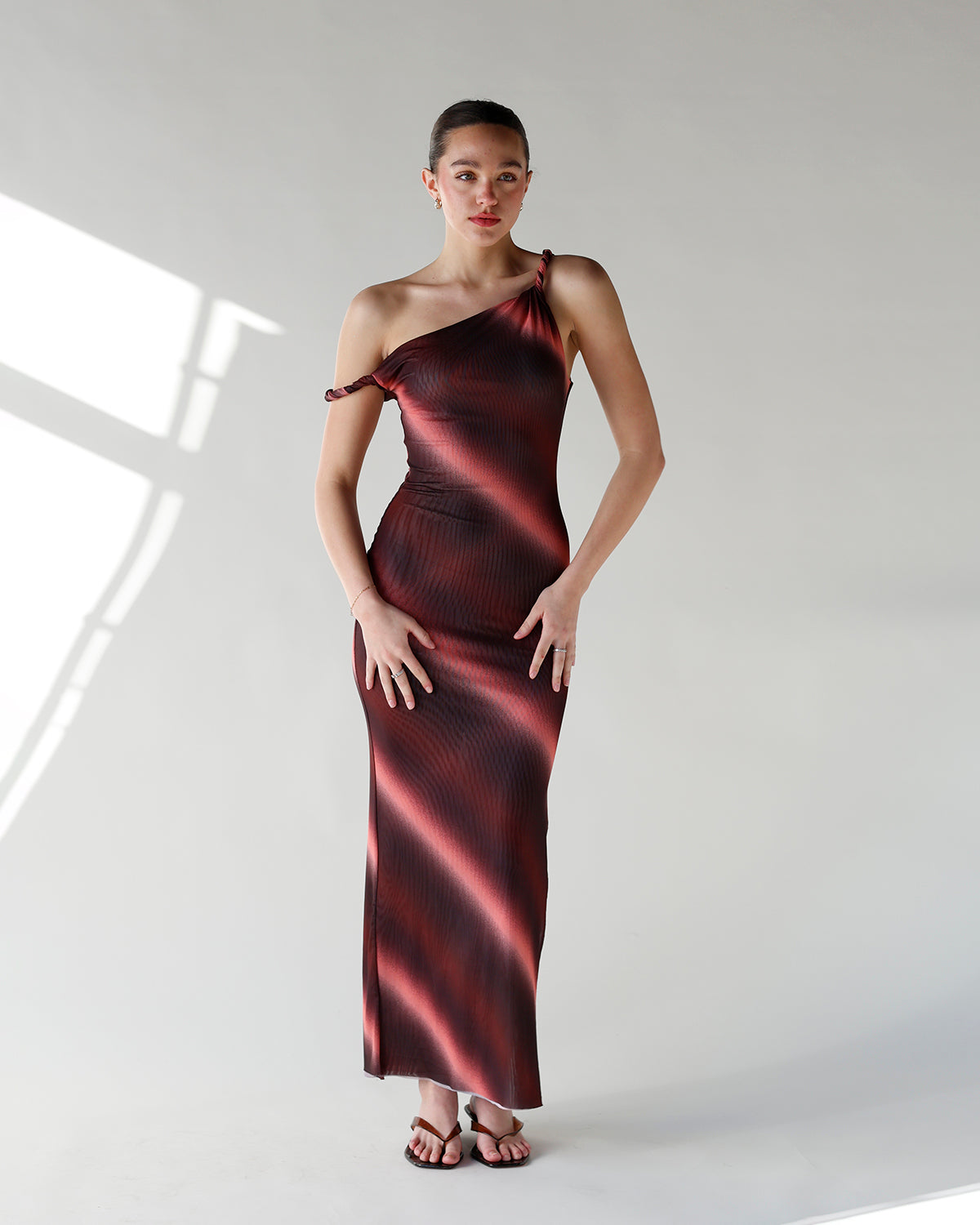 one shoulder maxi dress with burgundy and pink gradient pattern