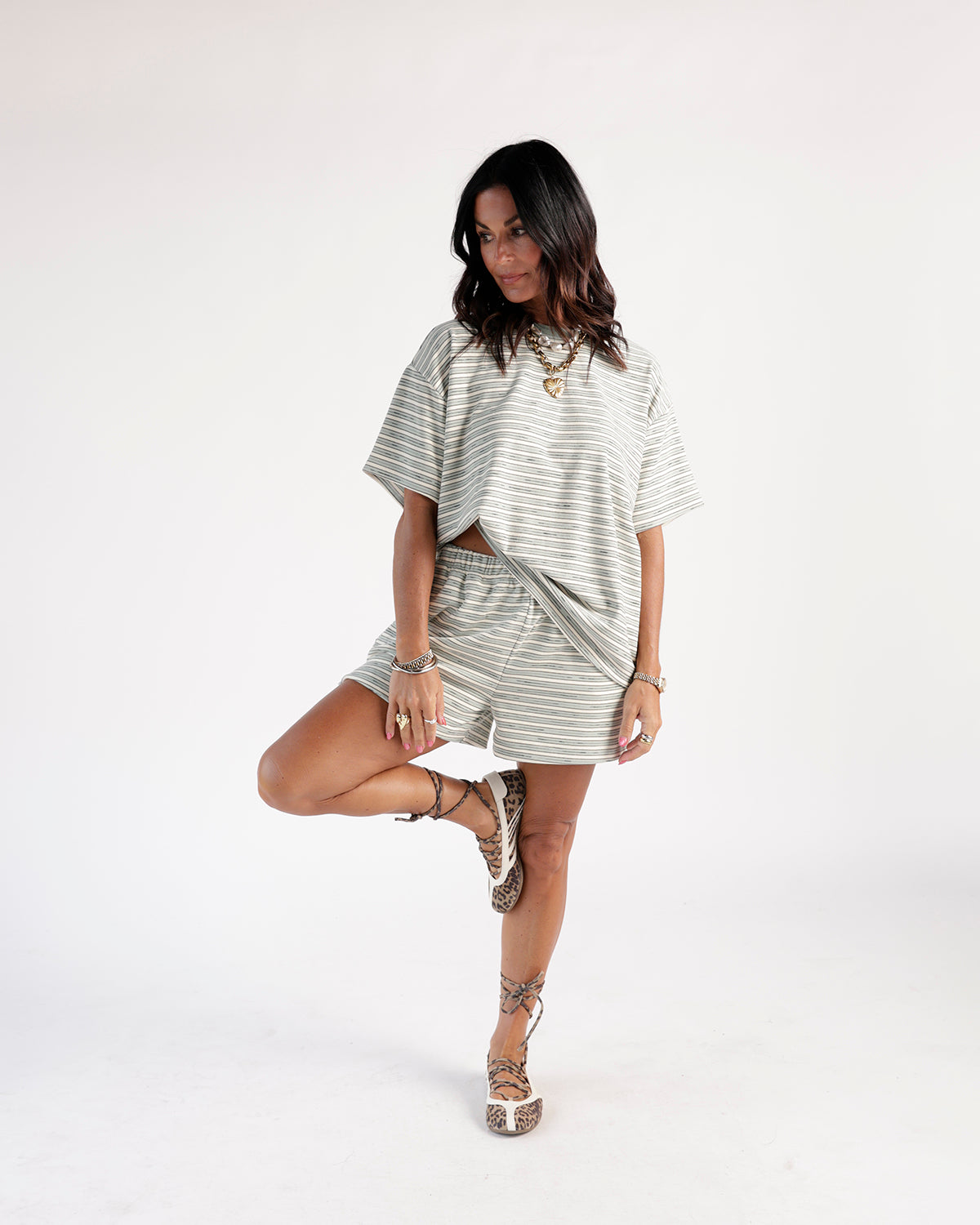 Oversized sage green striped short-sleeve tee with relaxed fit and crew neck