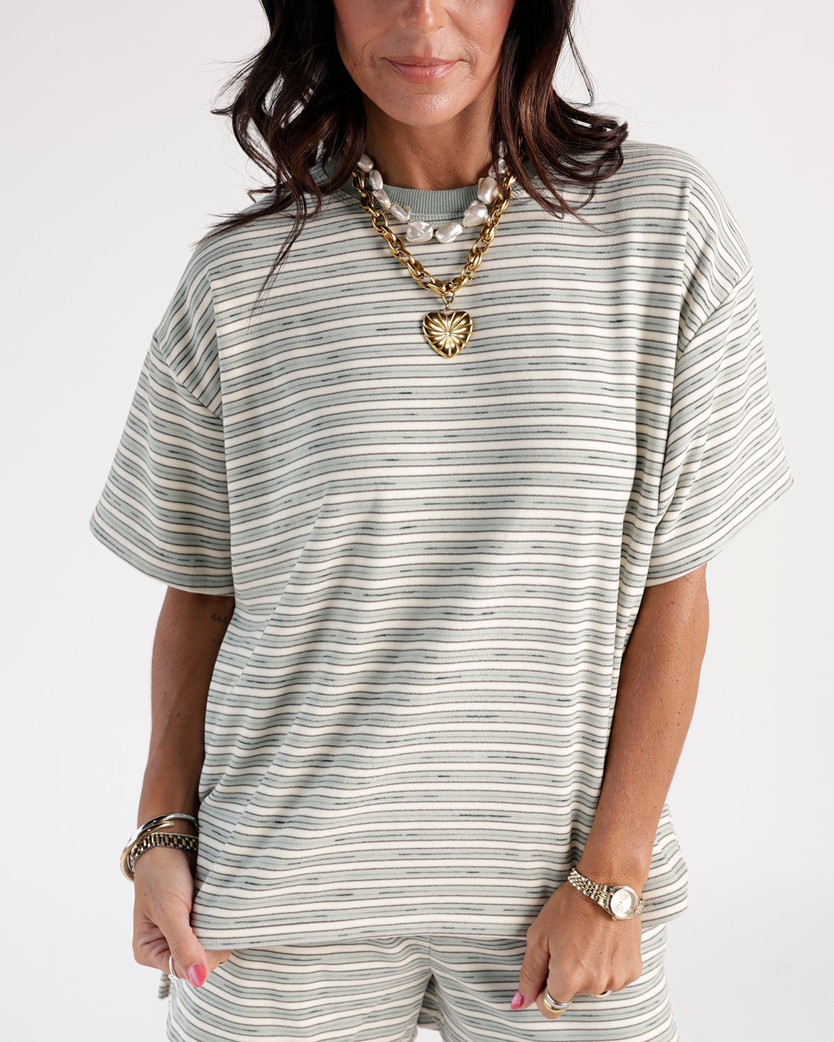 Add a warm touch to your casual look with this mint condition Striped Tee. Comes with contrasting mint neckline and soft material for comfort.