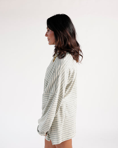 Cream and sage green striped oversized long sleeve top, side view