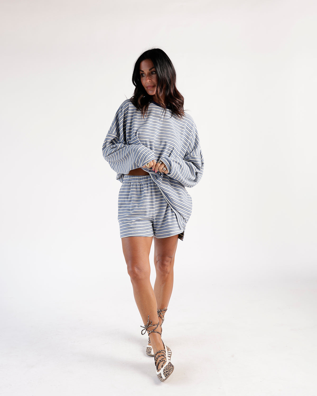 Blue and white striped shorts with elastic waistband, relaxed fit