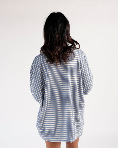 Oversized blue and white striped long sleeve top, back view, relaxed fit