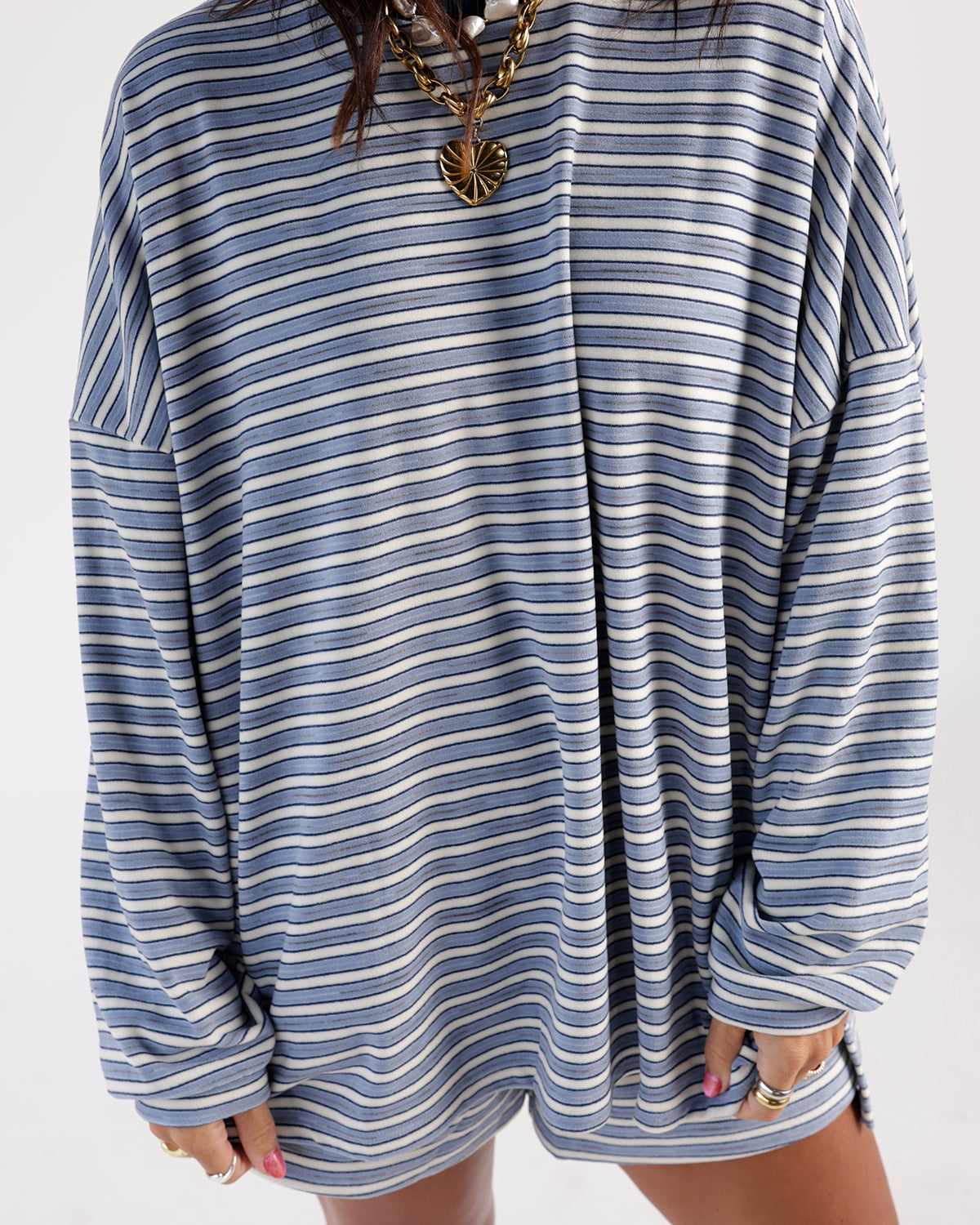 Oversized blue and white striped long sleeve top with drop shoulders