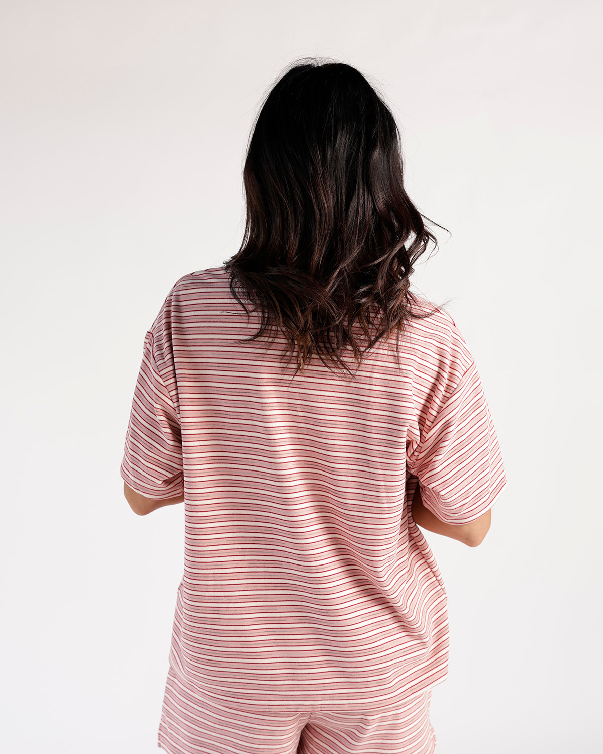 Red and white striped oversized short-sleeve tee, back view, relaxed fit