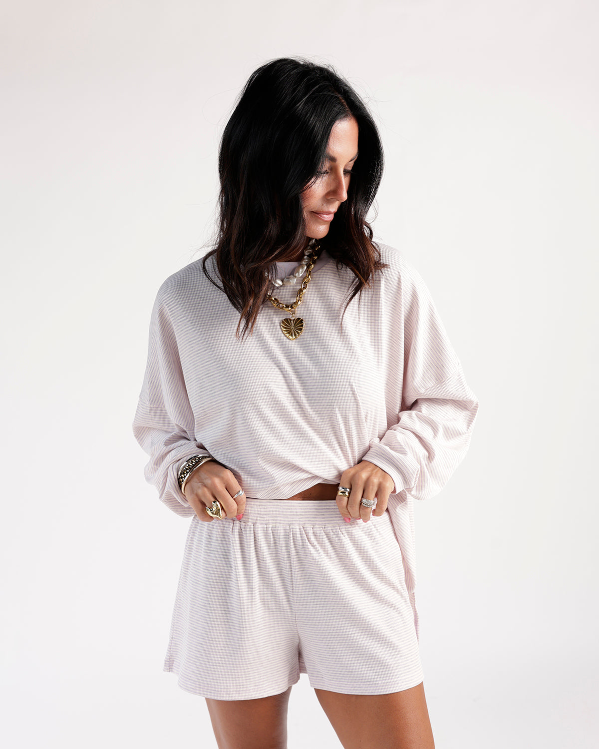 Lilac striped casual shorts with elastic waistband, paired with matching long-sleeve top.