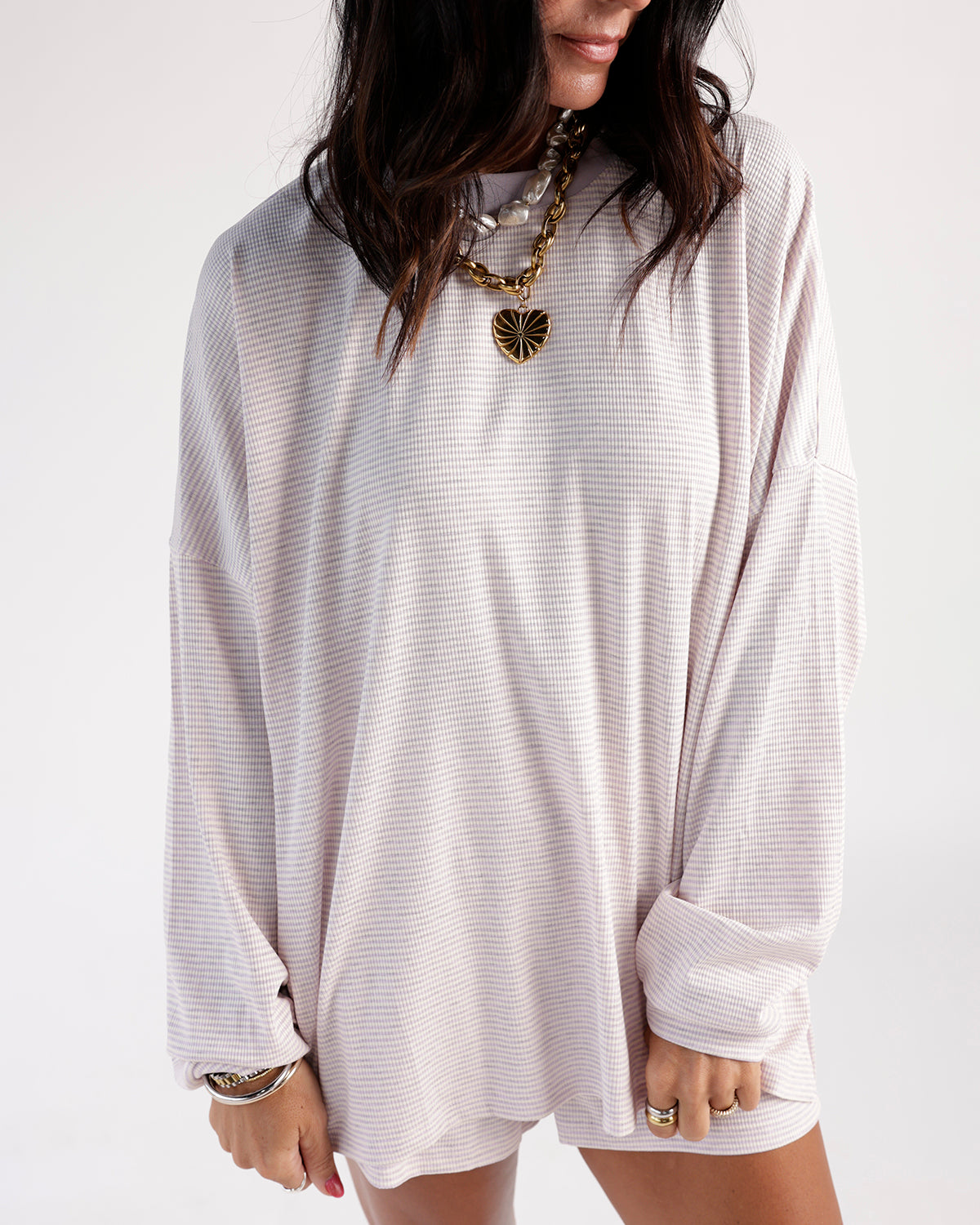 Oversized lilac striped long sleeve top with relaxed fit and dropped shoulders