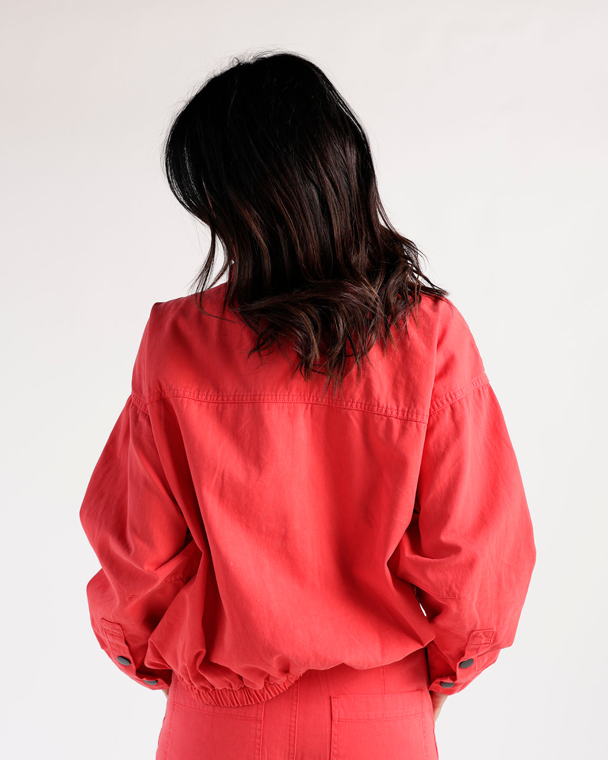 Red funnel neck jacket with balloon sleeves and elastic hem, back view