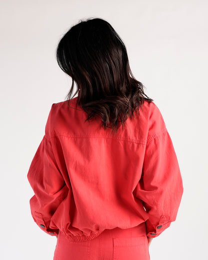 Red funnel neck jacket with balloon sleeves and elastic hem, back view